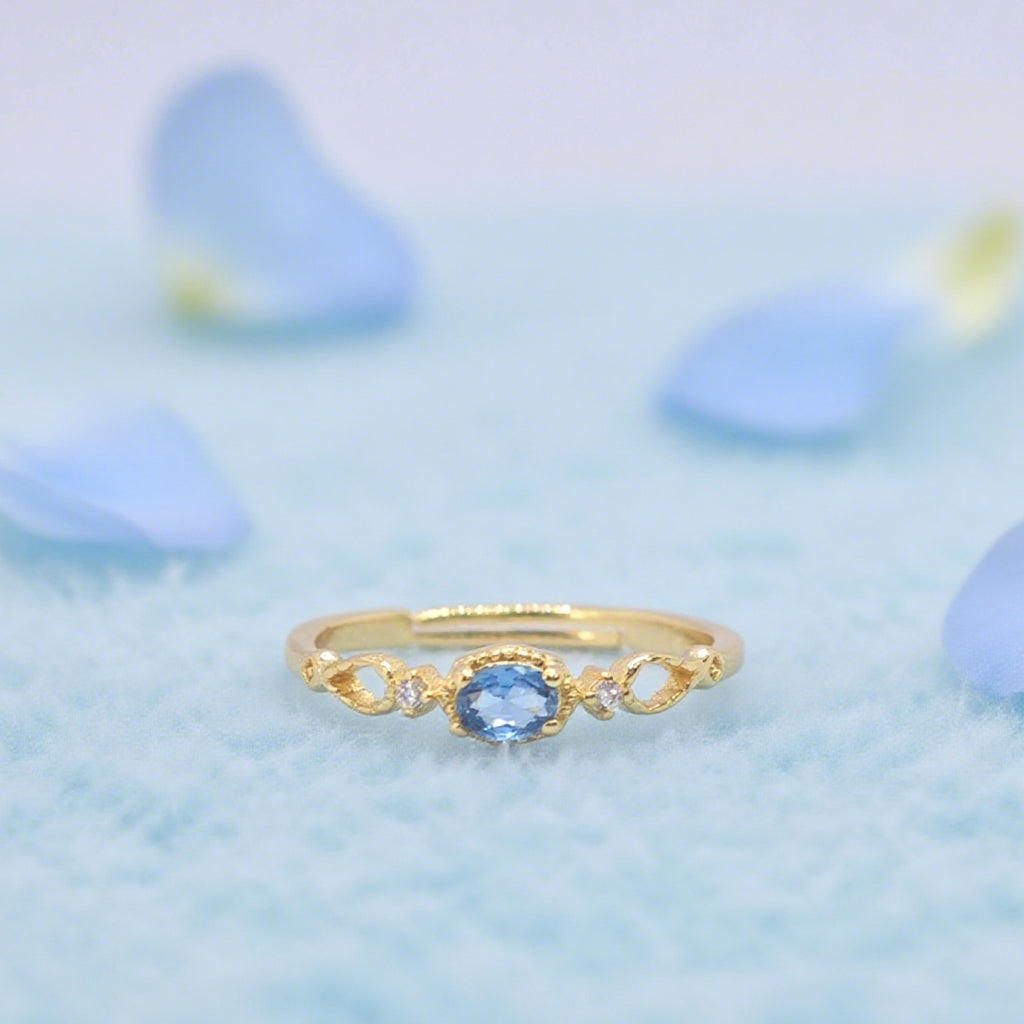 Bague réglable « Toujours » — Plaqué or 14 carats, fausse apatite bleu Paraíba et oxydes de zirconium clairs L’Ardeur