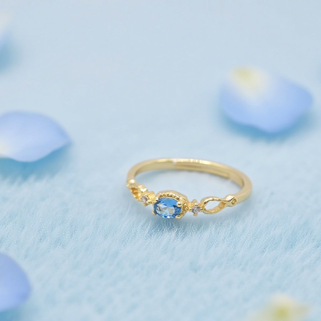 Bague réglable « Toujours » — Plaqué or 14 carats, fausse apatite bleu Paraíba et oxydes de zirconium clairs L’Ardeur