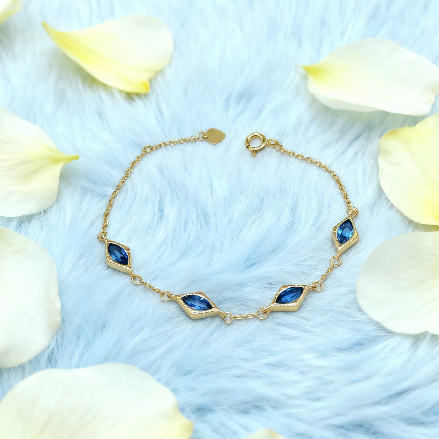Bracelet « Lien » — Maillons losanges en topaze bleue d'imitation, plaqué or 18 carats