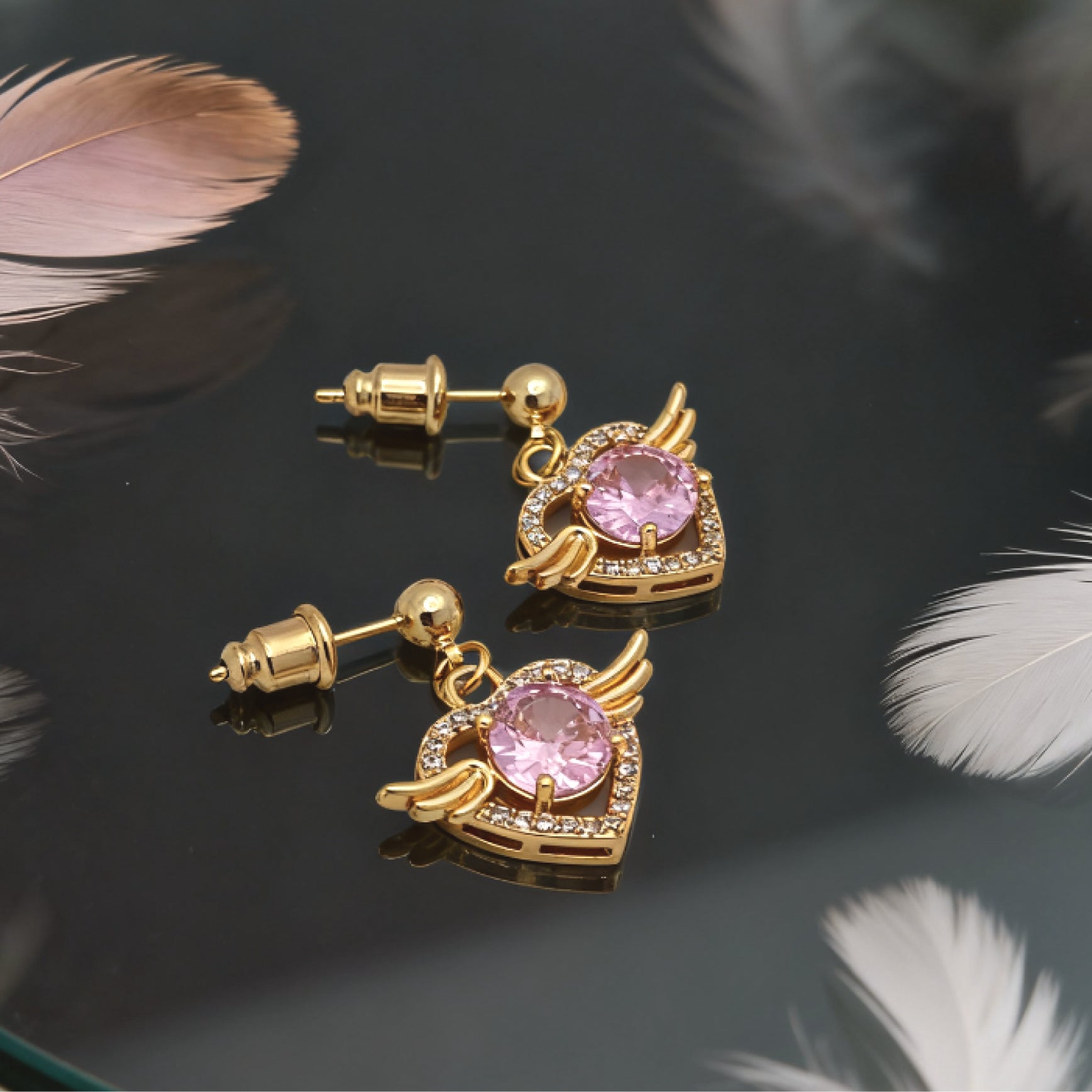 “Éclat” Angel Wing Heart Drop Earrings — 18K Gold‑Plated, Pink Diamond‑Style